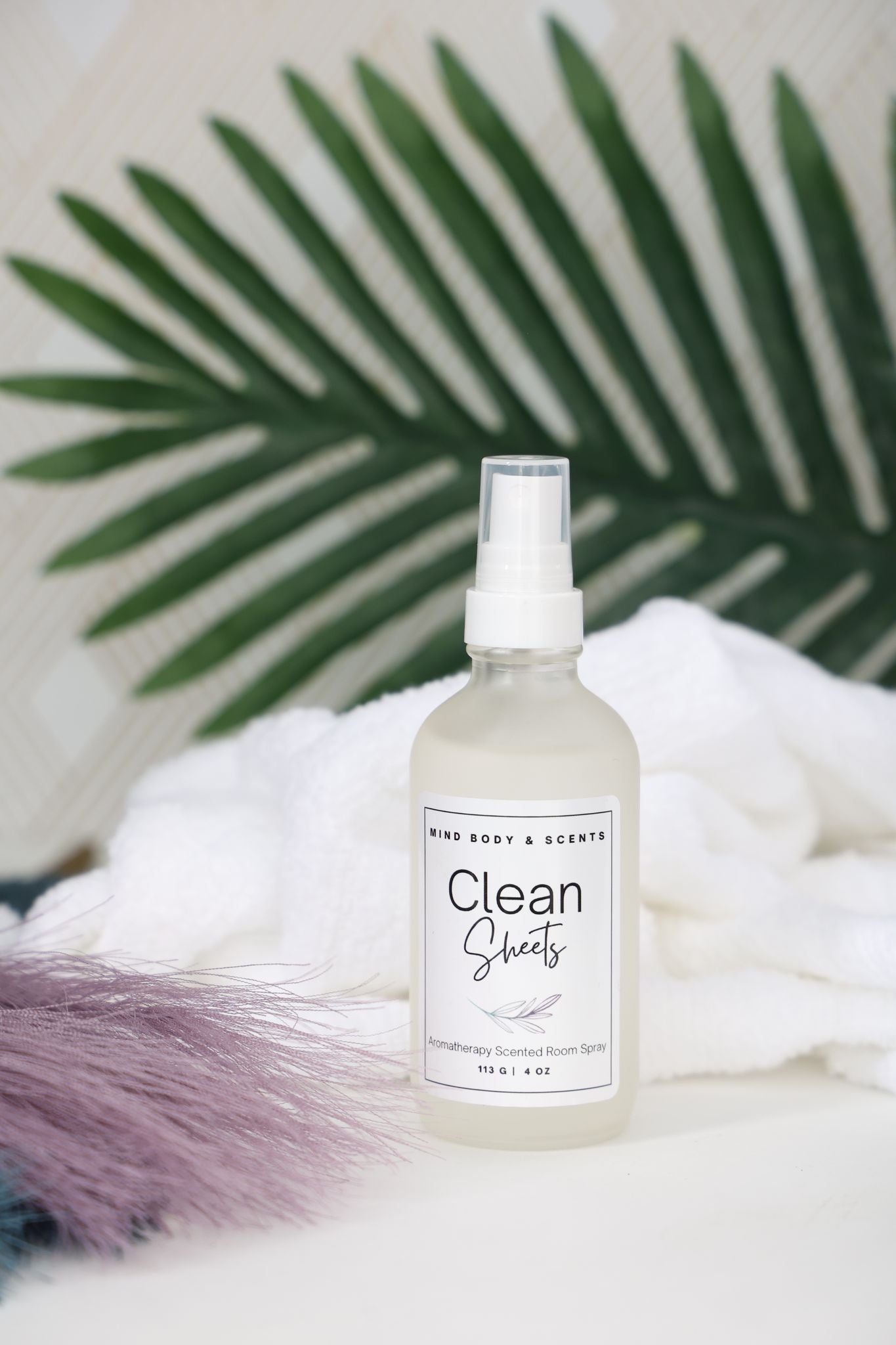 Clear aromatherapy room spray bottle with lemon and lavender essential oil fragrances 